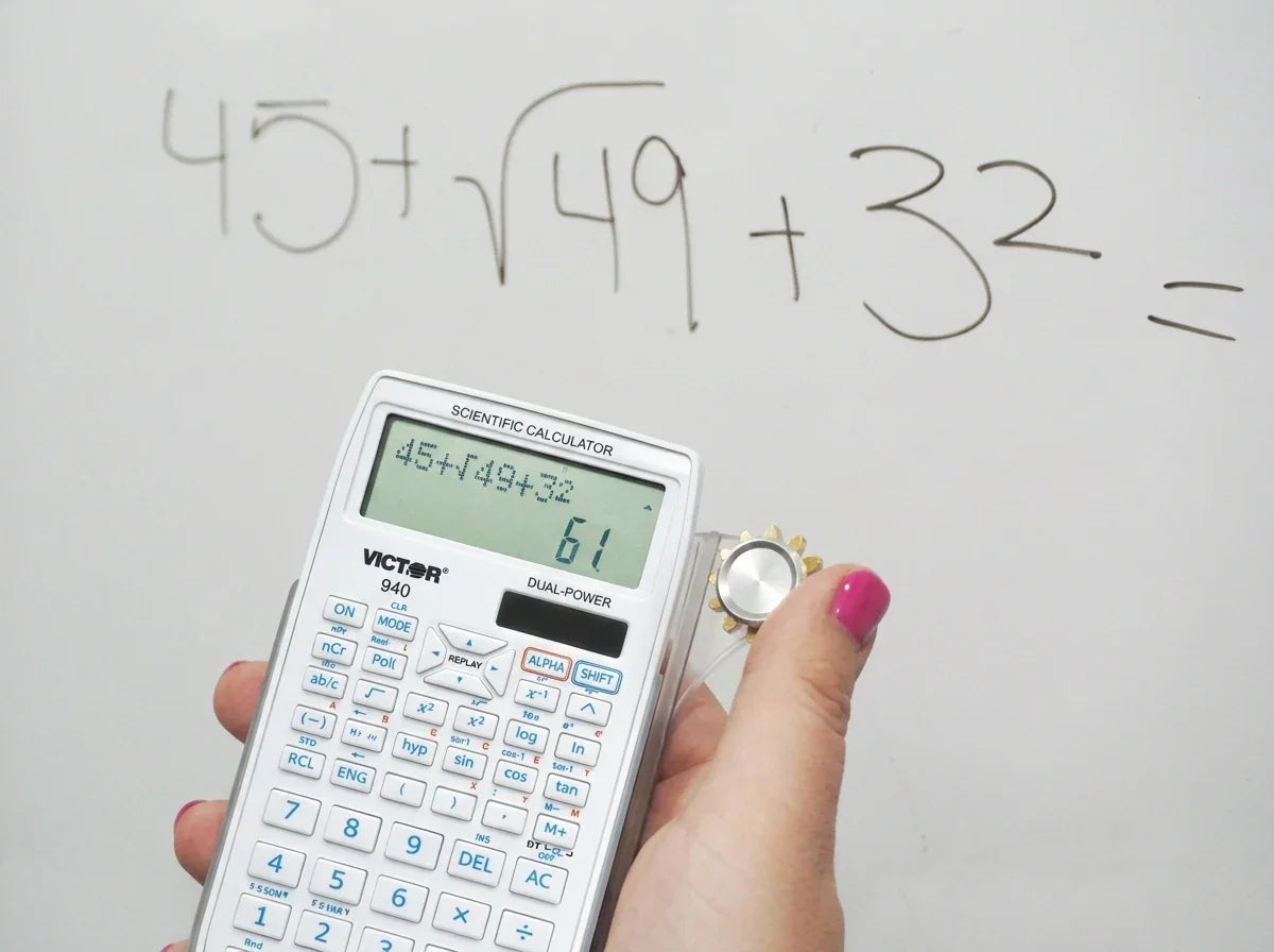 Person using a white scientific calculator to solve a math equation on a whiteboard.
