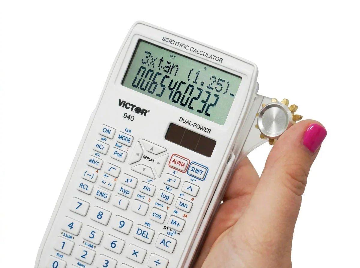 Hand holding a white scientific calculator displaying calculations, close-up view